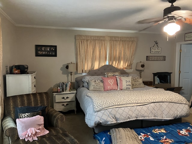 carpeted bedroom with a ceiling fan and crown molding