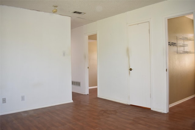 4912 Williford Rd, Sachse, TX 75048 - unfurnished bedroom featuring wood finished floors, visible vents, and baseboards
