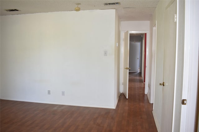 4912 Williford Rd, Sachse, TX 75048 - spare room with visible vents, dark wood-style floors, and baseboards