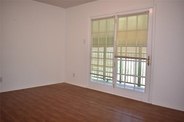 4912 Williford Rd, Sachse, TX 75048 - empty room featuring baseboards and dark wood-style flooring