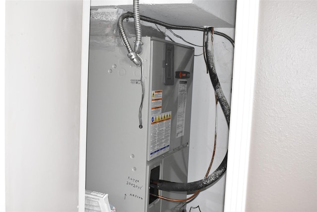 utility room with heating unit