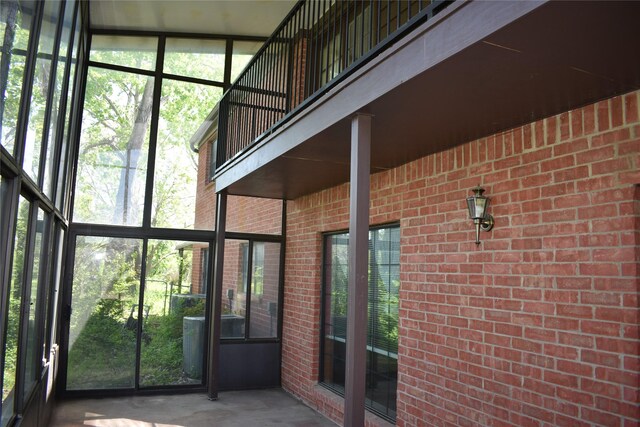 4912 Williford Rd, Sachse, TX 75048 - exterior space featuring a balcony and brick siding