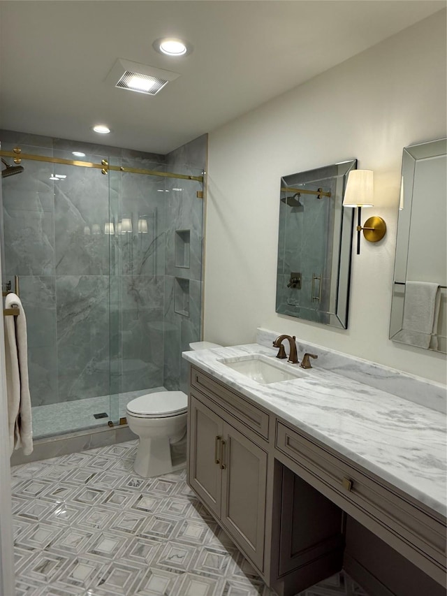 bathroom featuring toilet, visible vents, recessed lighting, a shower stall, and vanity