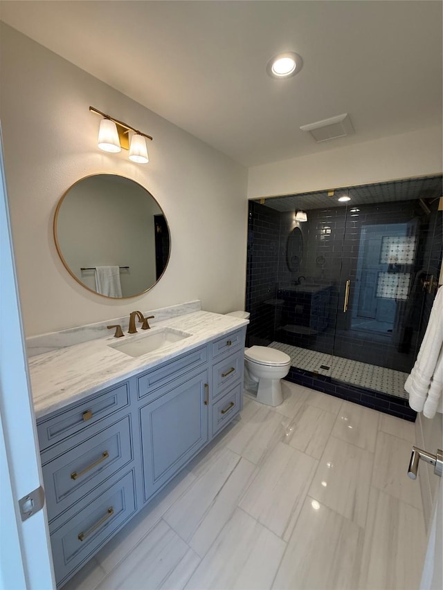 full bath featuring a shower stall, toilet, and vanity