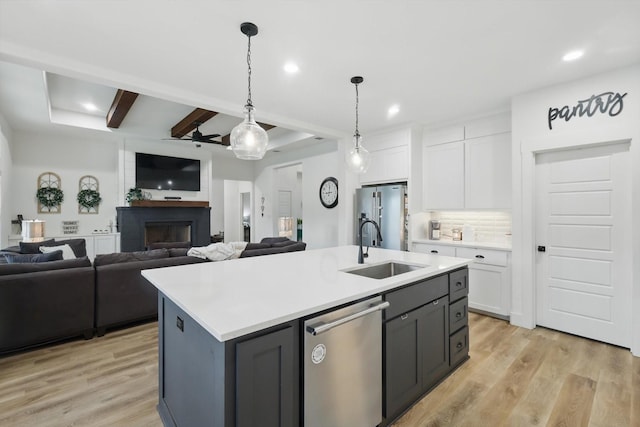 3728 George Owens Rd, Ponder, TX 76259 - kitchen with appliances with stainless steel finishes, a sink, white cabinetry, open floor plan, and recessed lighting