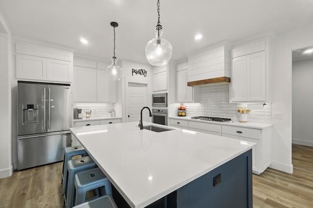 3728 George Owens Rd, Ponder, TX 76259 - kitchen featuring appliances with stainless steel finishes, a sink, decorative backsplash, light countertops, and recessed lighting