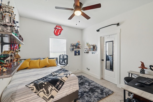 3728 George Owens Rd, Ponder, TX 76259 - carpeted bedroom featuring multiple windows, baseboards, and a ceiling fan