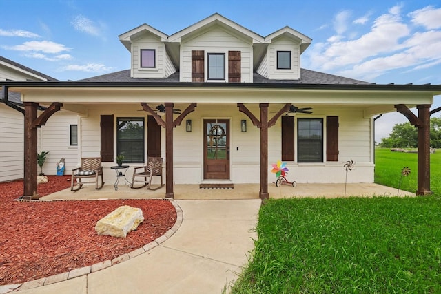 3728 George Owens Rd, Ponder, TX 76259 - view of front of property with a ceiling fan, a porch, a front lawn, and roof with shingles