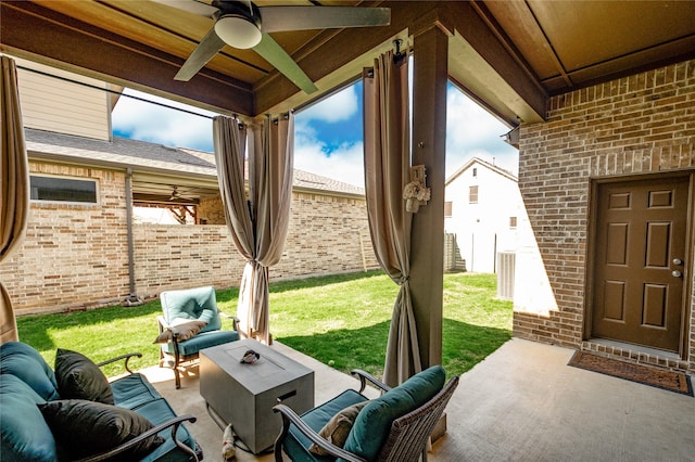 view of patio / terrace with fence, an outdoor living space, and ceiling fan