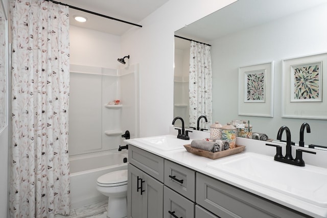 full bath with double vanity, shower / tub combo with curtain, marble finish floor, and a sink