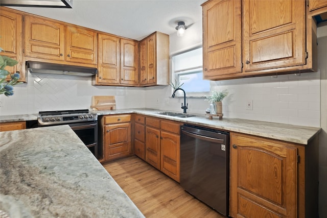 6245 Century Dr, Kennedale, TX 76060 - kitchen with under cabinet range hood, stainless steel appliances, light countertops, a sink, and decorative backsplash