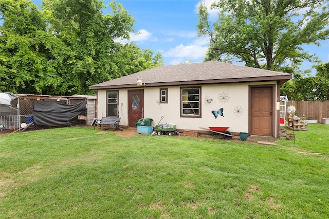 6245 Century Dr, Kennedale, TX 76060 - rear view of property featuring stucco siding, a lawn, a shingled roof, and fence