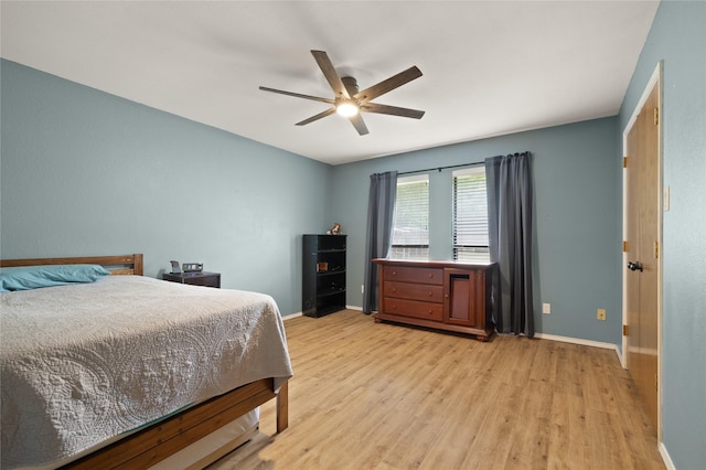 6245 Century Dr, Kennedale, TX 76060 - bedroom with light wood finished floors, a ceiling fan, and baseboards