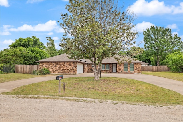 6245 Century Dr, Kennedale, TX 76060 - ranch-style house featuring a front lawn, fence, an attached garage, and curved driveway