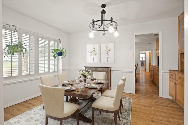 6245 Century Dr, Kennedale, TX 76060 - dining area with an inviting chandelier and light wood-type flooring