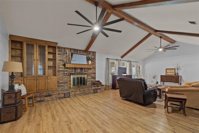 6245 Century Dr, Kennedale, TX 76060 - living room with a ceiling fan, wood finished floors, visible vents, and vaulted ceiling with beams