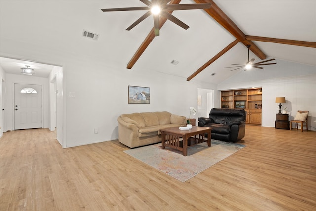 6245 Century Dr, Kennedale, TX 76060 - living area featuring wood finished floors, vaulted ceiling with beams, a ceiling fan, and visible vents