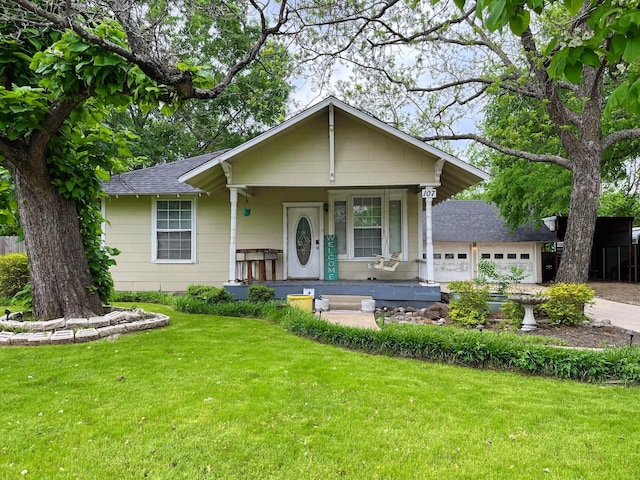 107 N Main St, Crandall, TX 75114 - single story home with a porch, concrete driveway, a garage, a shingled roof, and a front yard