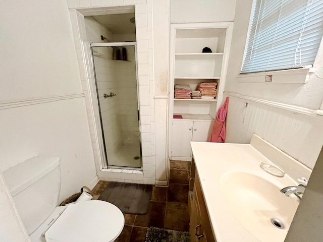 107 N Main St, Crandall, TX 75114 - bathroom with built in shelves, vanity, a shower stall, and toilet