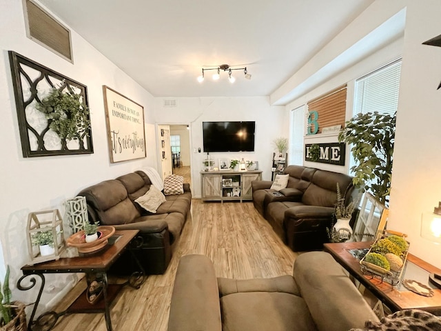 107 N Main St, Crandall, TX 75114 - living room featuring wood finished floors and visible vents