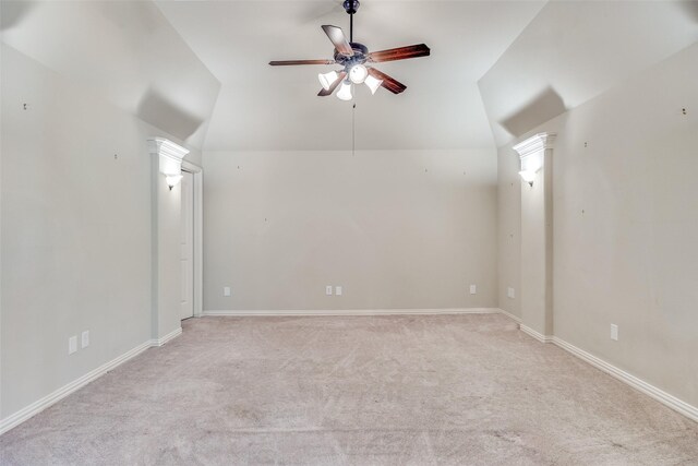bonus room with lofted ceiling, light carpet, baseboards, and ceiling fan