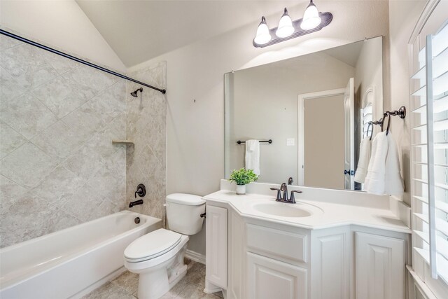 bathroom with tile patterned flooring, vaulted ceiling, toilet, vanity, and bathtub / shower combination
