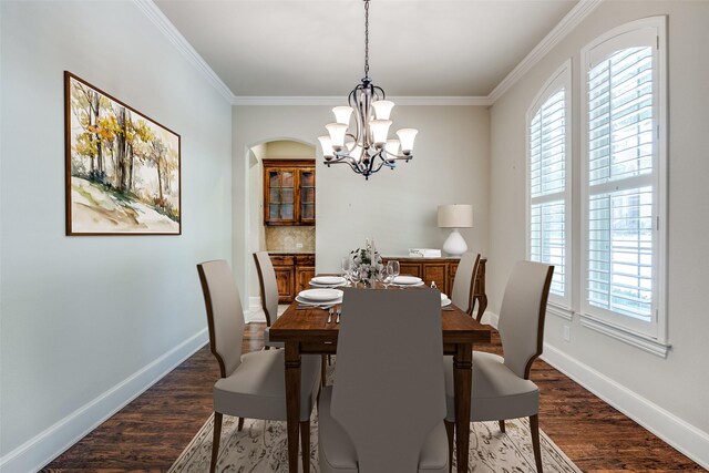 dining area featuring dark wood-style floors, a wealth of natural light, and a notable chandelier