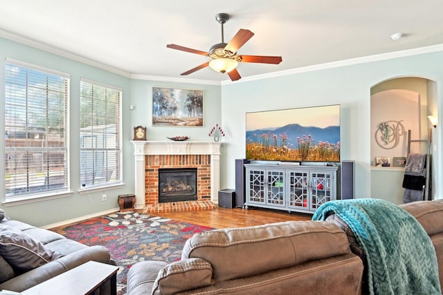 202 Beacon Hill Ln, Forney, TX 75126 - living room featuring ornamental molding, ceiling fan, wood finished floors, healthy amount of natural light, and a brick fireplace