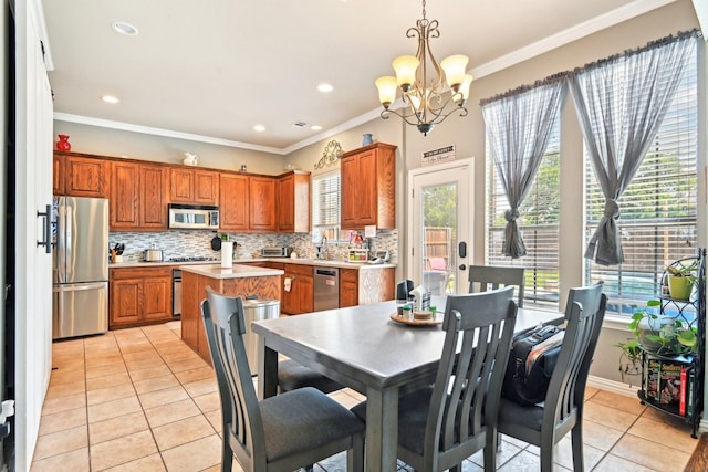 202 Beacon Hill Ln, Forney, TX 75126 - dining space featuring light tile patterned floors, a chandelier, crown molding, recessed lighting, and baseboards