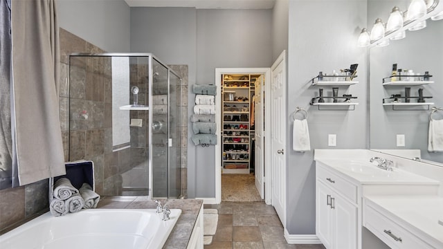 202 Beacon Hill Ln, Forney, TX 75126 - bathroom with a shower stall, a garden tub, vanity, and a spacious closet