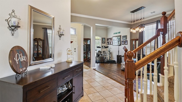 202 Beacon Hill Ln, Forney, TX 75126 - foyer with arched walkways, crown molding, light tile patterned flooring, stairs, and a chandelier