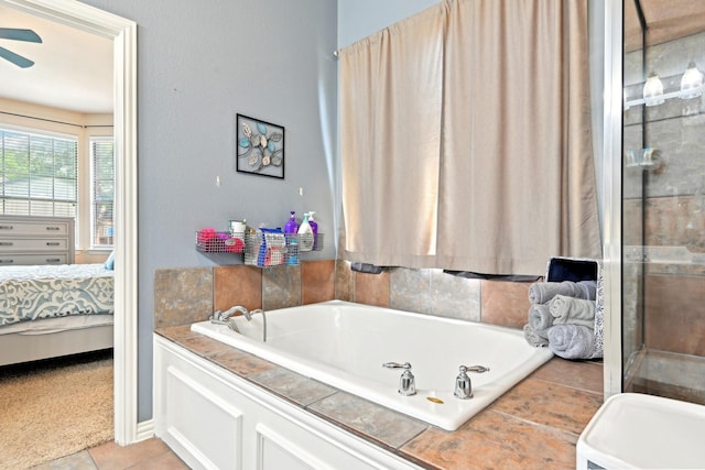 202 Beacon Hill Ln, Forney, TX 75126 - ensuite bathroom featuring a bath, tile patterned floors, a ceiling fan, and a tile shower