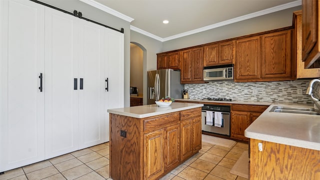 202 Beacon Hill Ln, Forney, TX 75126 - kitchen with appliances with stainless steel finishes, arched walkways, light tile patterned floors, backsplash, and ornamental molding