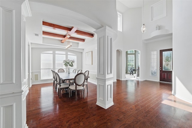 5808 Arabian Dr, Grand Prairie, TX 75052 - dining room featuring dark wood-style floors, arched walkways, beam ceiling, visible vents, and ornate columns