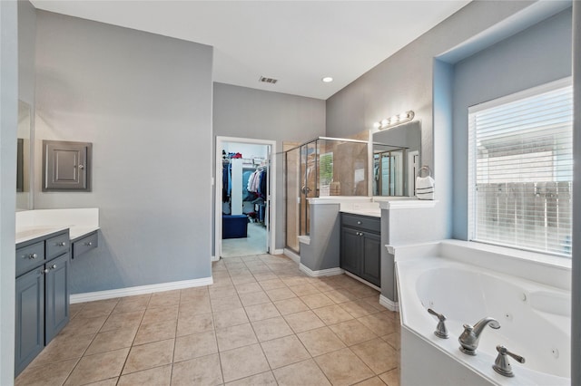 5808 Arabian Dr, Grand Prairie, TX 75052 - bathroom with a stall shower, visible vents, a jetted tub, tile patterned flooring, and vanity