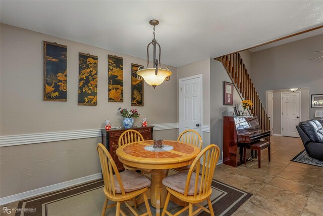 bedroom with baseboards, light colored carpet, and ceiling fan