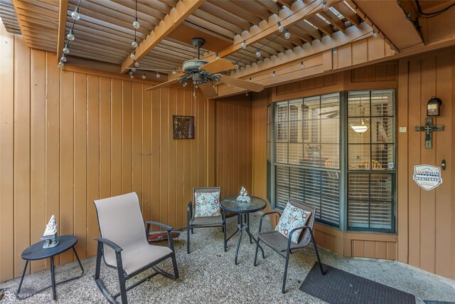 view of patio featuring fence and ceiling fan