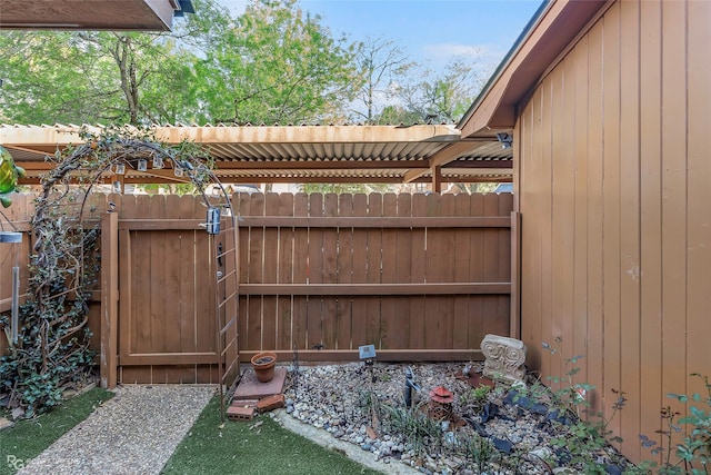 view of gate with fence