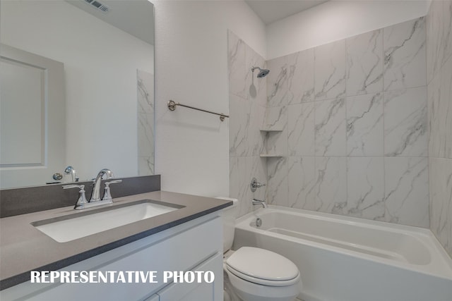 bathroom featuring toilet, vanity, and washtub / shower combination