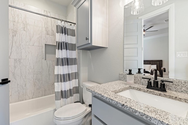 bathroom with vanity, ceiling fan, shower / bath combination with curtain, toilet, and visible vents