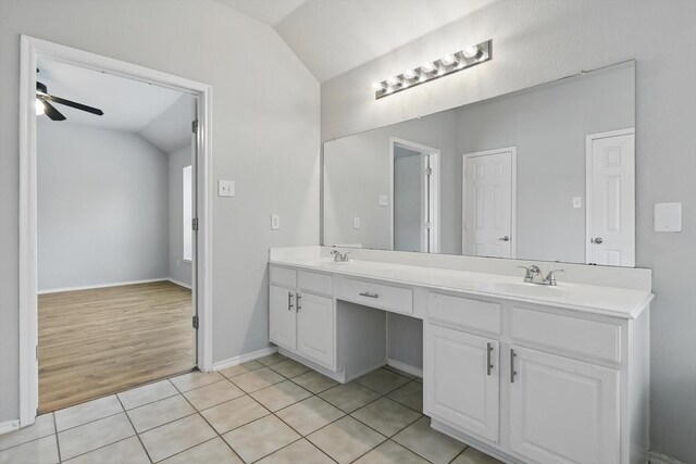 909 Whisper Ln, Mckinney, TX 75072 - full bathroom with lofted ceiling, double vanity, ceiling fan, and tile patterned flooring
