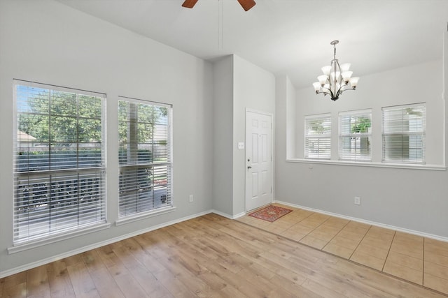 909 Whisper Ln, Mckinney, TX 75072 - foyer featuring a chandelier, ceiling fan, wood finished floors, and vaulted ceiling