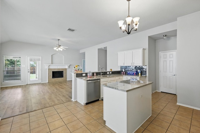 909 Whisper Ln, Mckinney, TX 75072 - kitchen featuring dishwasher, a chandelier, ceiling fan, light tile patterned floors, and lofted ceiling
