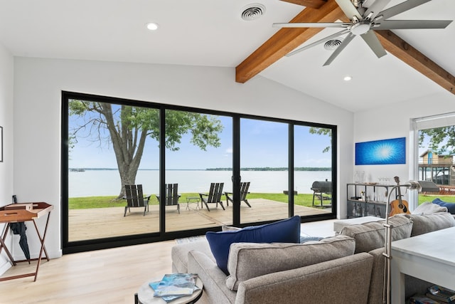 living area featuring recessed lighting, vaulted ceiling with beams, wood finished floors, a water view, and visible vents