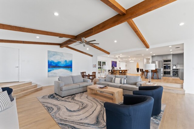 living room with recessed lighting, lofted ceiling with beams, a ceiling fan, and light wood-style floors