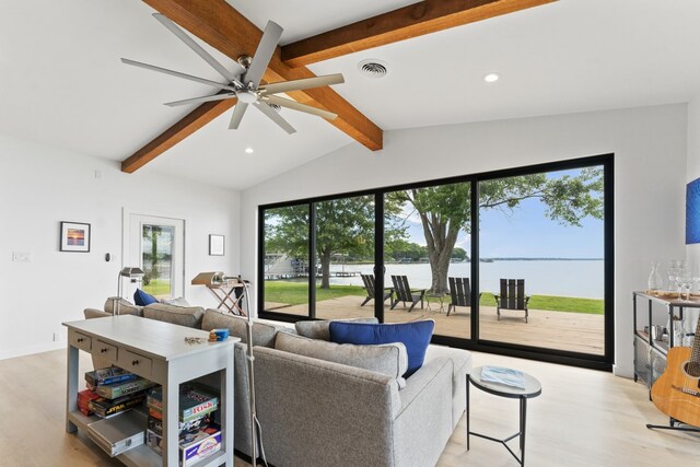 living room with light wood-style flooring, visible vents, a water view, recessed lighting, and vaulted ceiling with beams