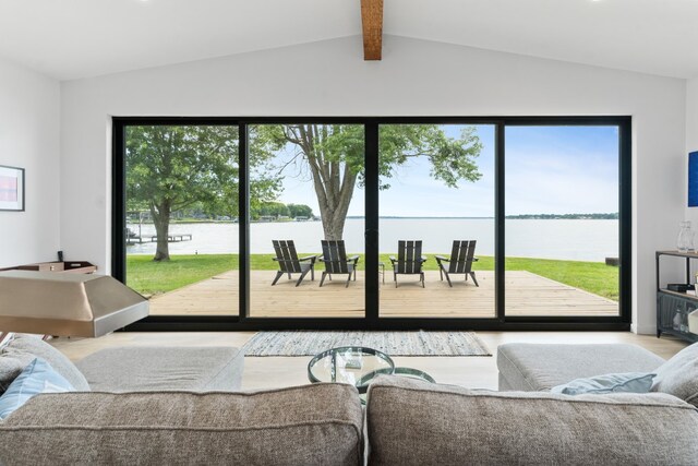 living room featuring wood finished floors and vaulted ceiling with beams