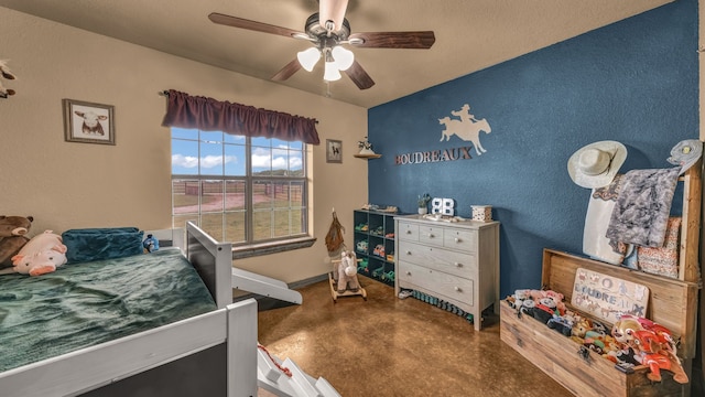 2380 County Road 422, Huckabay, TX 76401 - bedroom with ceiling fan and concrete flooring