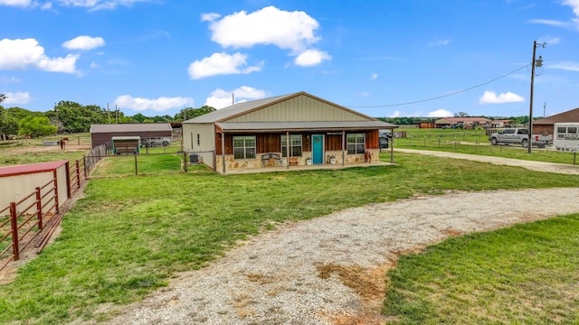 2380 County Road 422, Huckabay, TX 76401 - back of property with a lawn, fence, driveway, and a patio