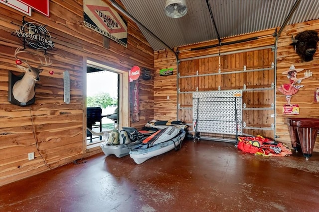 garage featuring wooden walls
